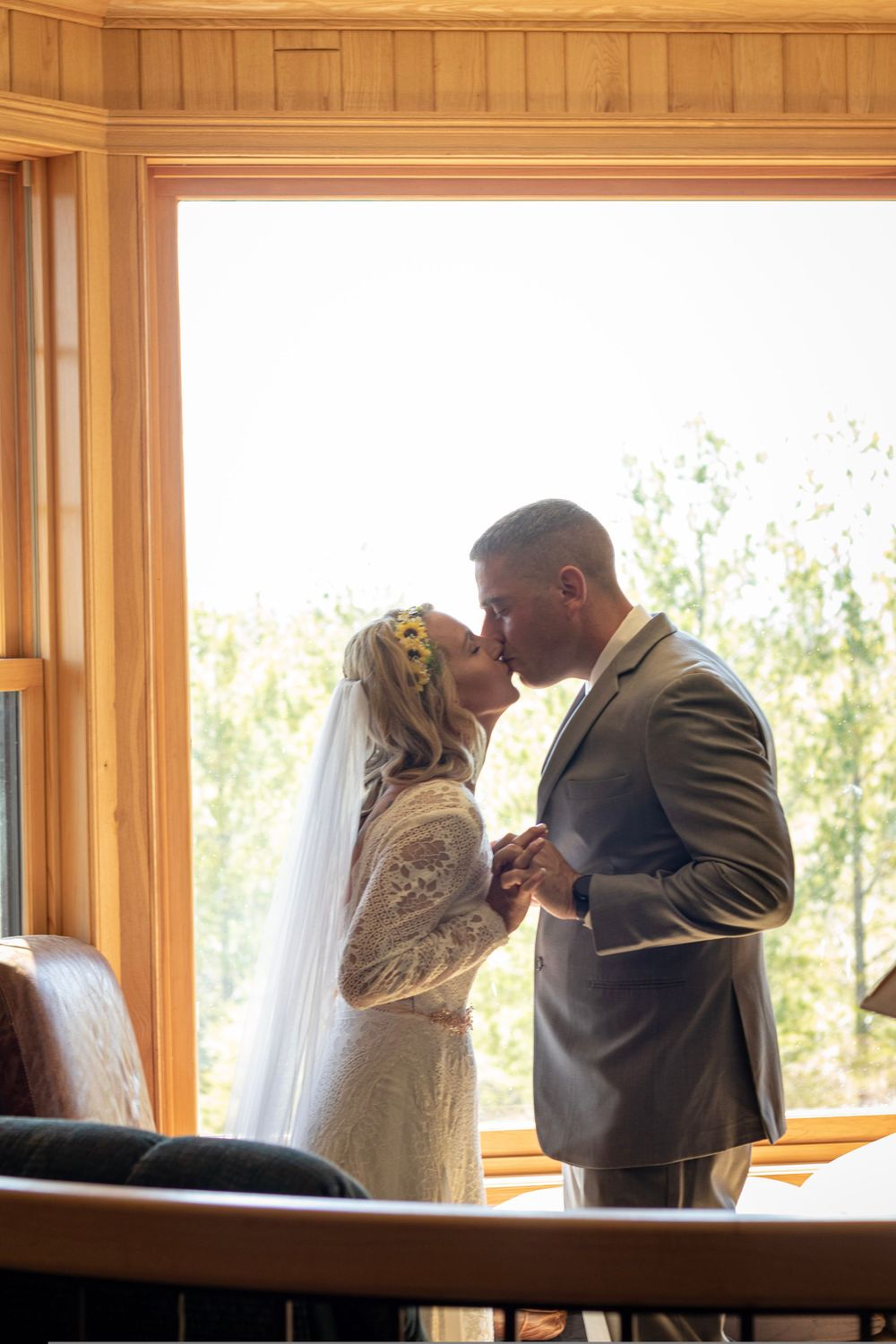 A series of intimate first look wedding photos showing a couple sharing an emotional moment by a window.
