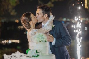 Romantic nighttime wedding portraits with sparklers creating a magical backdrop for the couple.