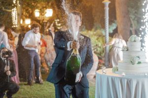 Outdoor wedding celebration with sparklers and decorative lighting creating a festive ambiance.