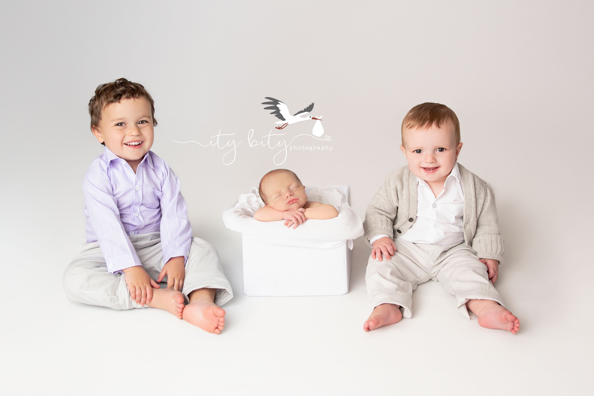 Newborn Baby Riley with his older sibling brothers during his Newborn Photography session Cleveland Ohio