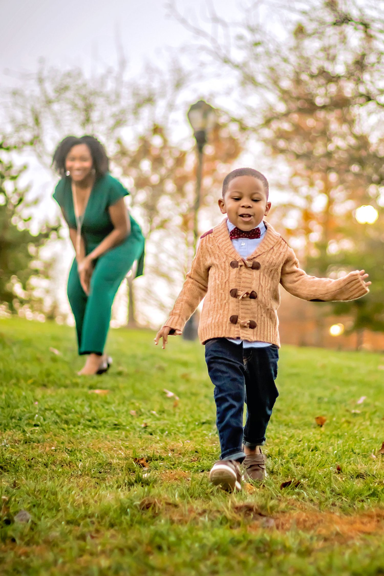louisville family photography toddler boy fall papa johns park waterfall orange leaves mom and son running
