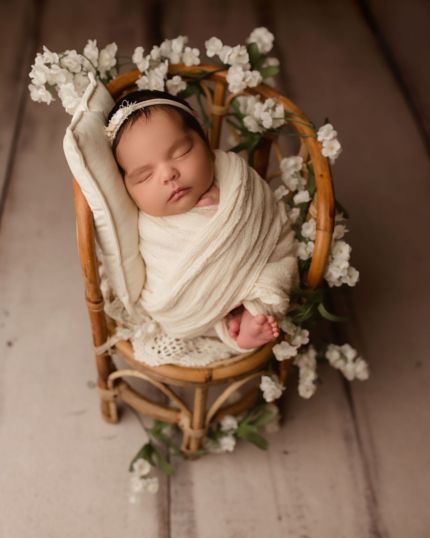 baby girl in floral chair, newborn photography in Moreno Valley ca