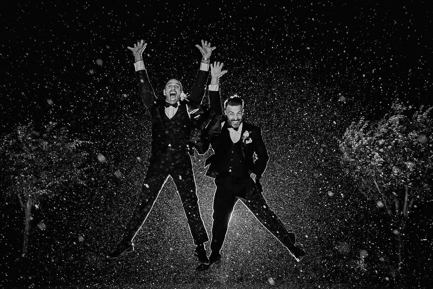 Two Grooms Jumping in the Rain at Night Photo - The Palace at Somerset Park - Gay Wedding - Lynn Monaco Photography - NJ