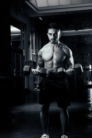Athlete doing a double biceps pose in a cinematic photo