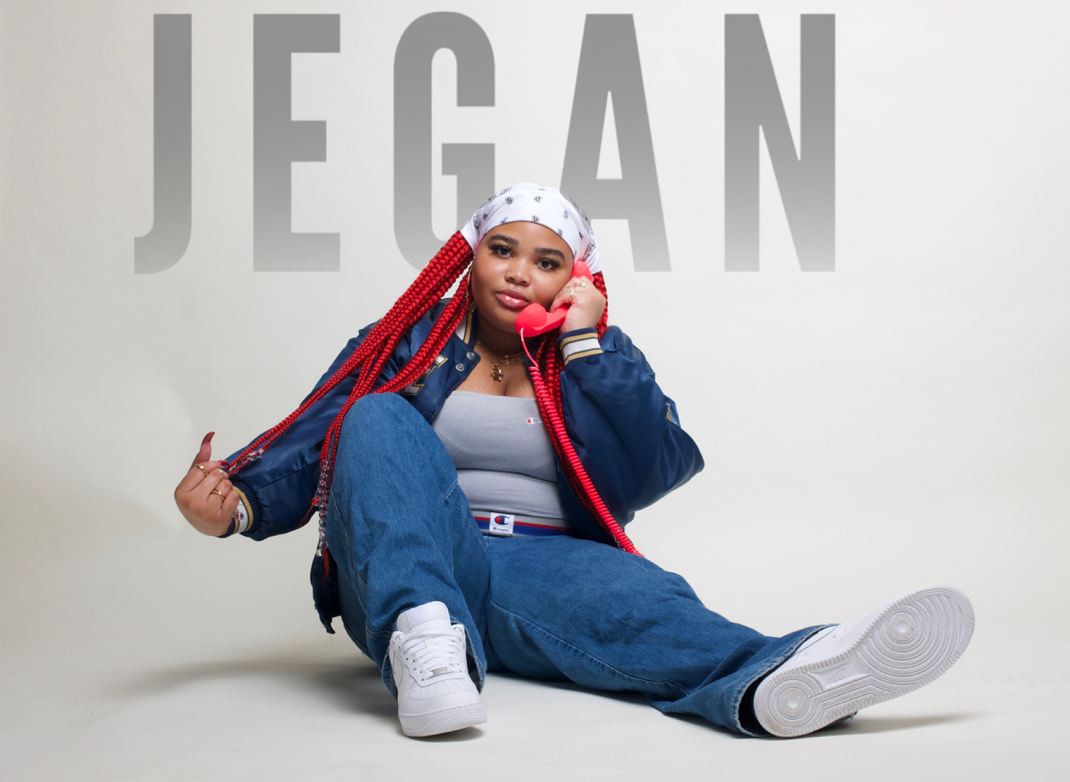 Casual portrait of person in oversized denim and red jacket with Jegan text overlay.