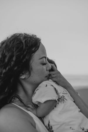 Intimate black and white portraits captured during a beach photo session.