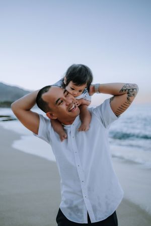 Candid moments of laughter and joy captured on a sunny beach.