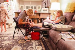 Candid living room scene showing a relaxed family gathering on a comfortable couch.
