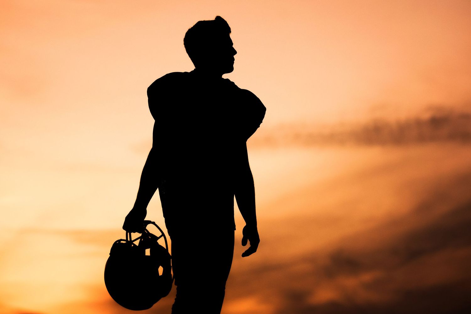 Plymouth, MA photographer Heidi Harting makes stunning sunset silhouette images of high school seniors