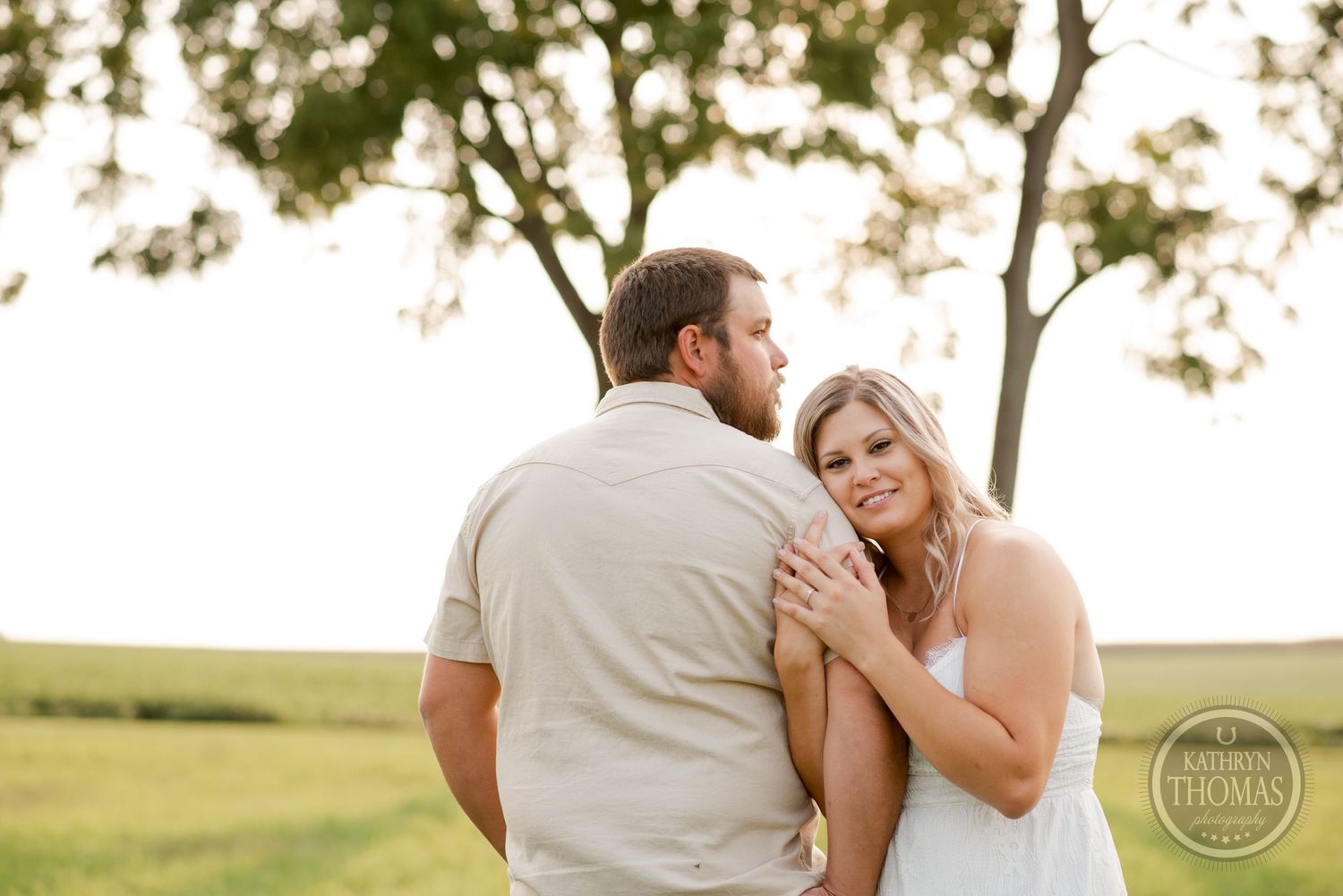 A sweet embrace captured during a sunset countryside photoshoot.