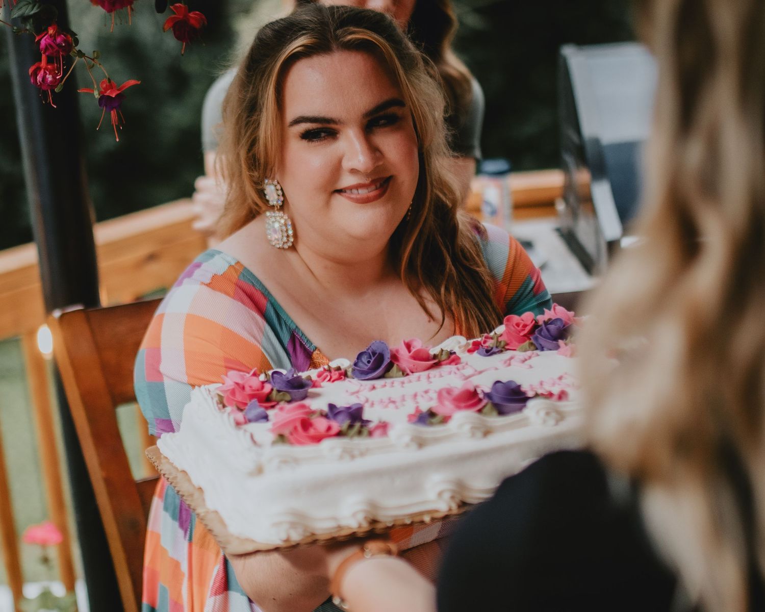 birthday girl smiling at cake