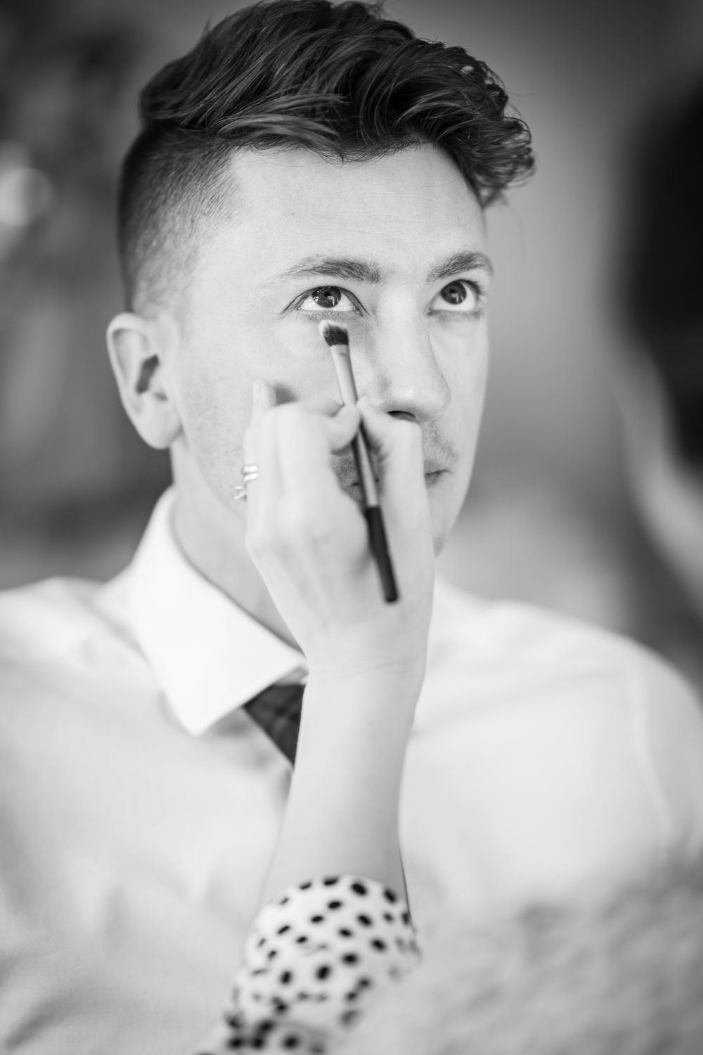 groom has eye makeup at the elvetham hotel