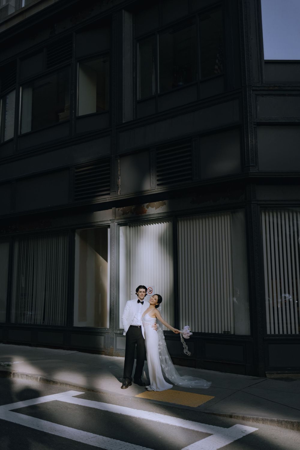 Dramatic lighting creates silhouettes in modern architectural space.