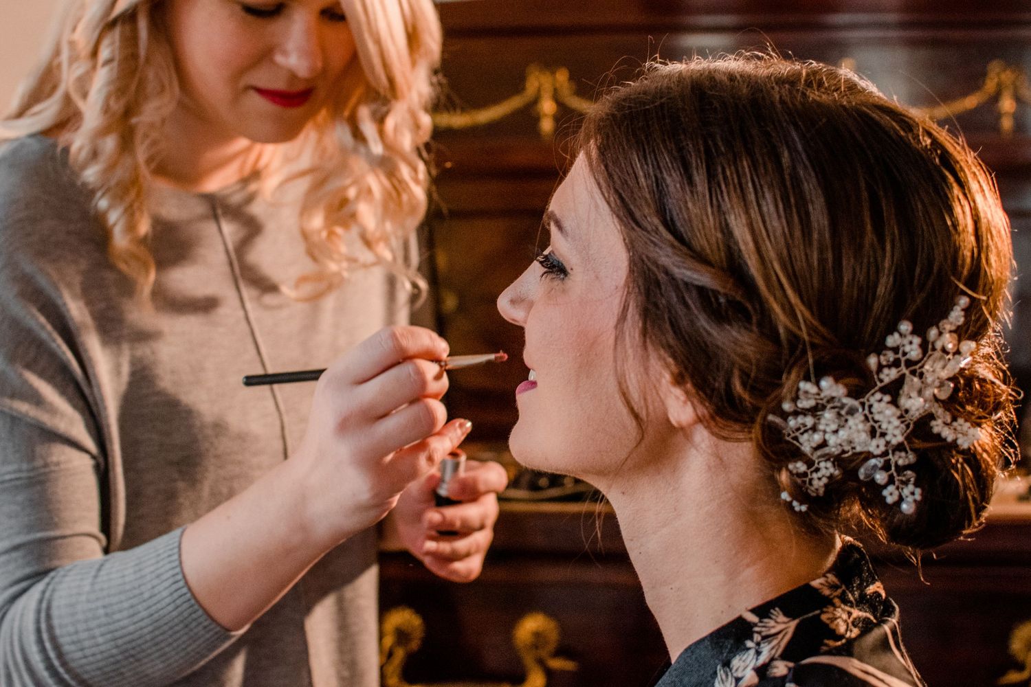 Close-up of makeup being applied during preparation.