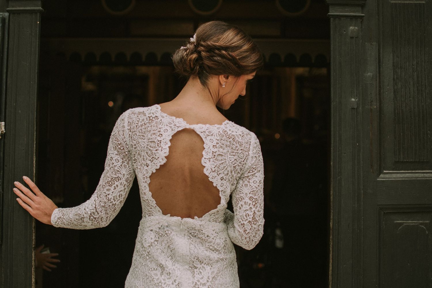 Back view of a lace wedding dress with an elegant open keyhole design.