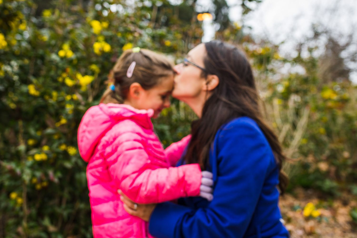 Mother kissing daughter in Seattle