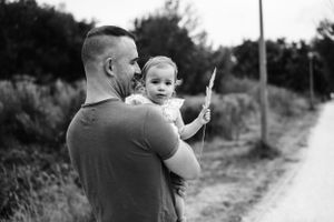 Black and white portrait on a winding countryside path.