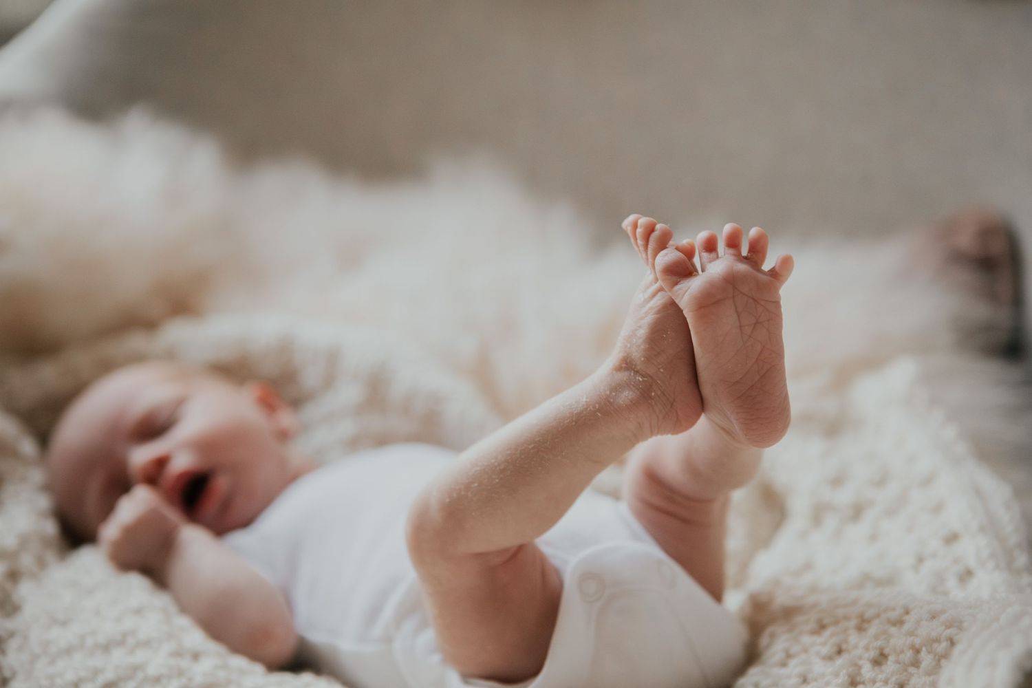 New born at home photo shoot with Cornwall new born photographer tiny feet