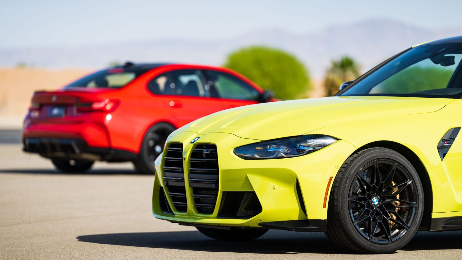 Row of colorful sports cars including yellow and red models lined up on display.