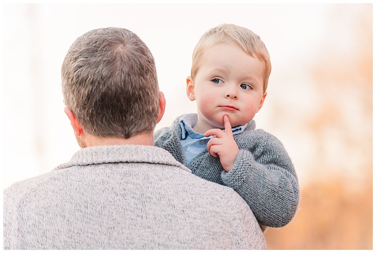 Adorable photo of father carrying toddler over shoulder during golden hour by Jayme Riggleman Family Photography
