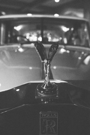 Classic Rolls Royce Spirit of Ecstasy hood ornament in black and white.