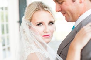 Intimate wedding portrait showing tender moment between newlyweds.