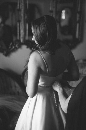 Back view of wedding dress with button detail in black and white.