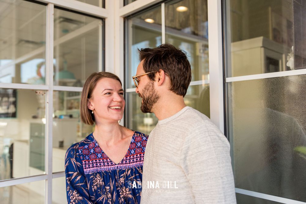 Husband and wife laughing with each other