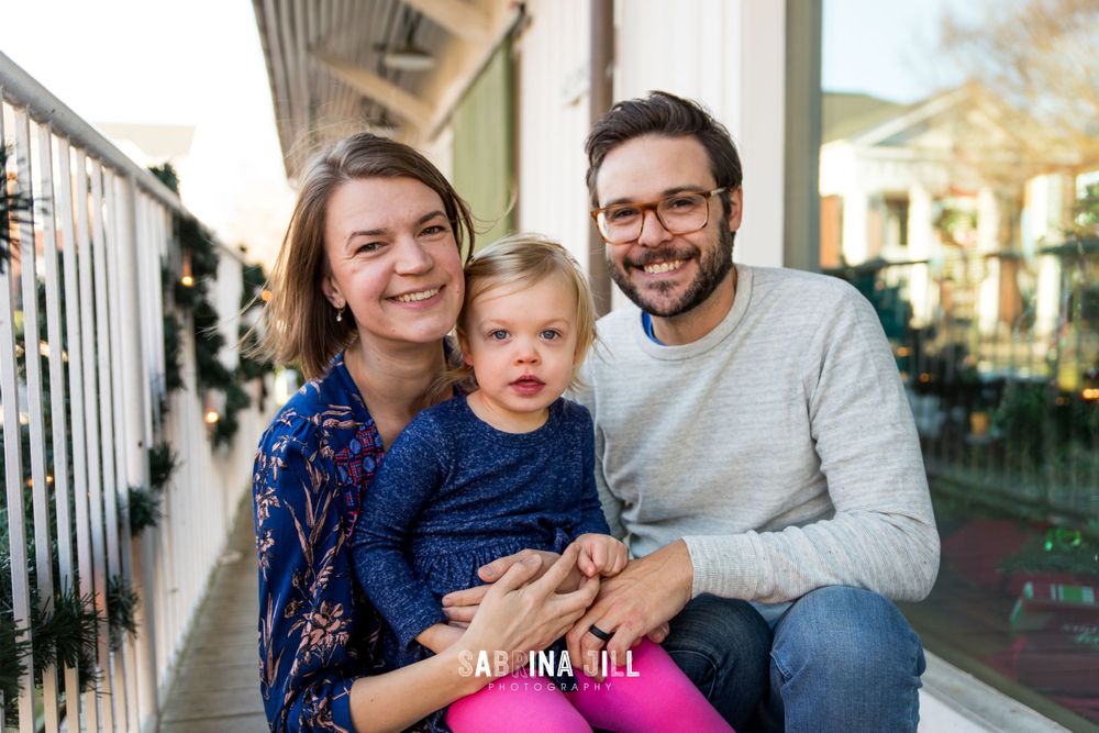 Family smiling in photo session in Matthews, NC