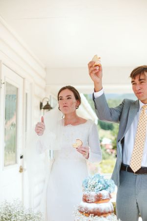 Celebratory moment with refreshments at an elegant indoor wedding reception.