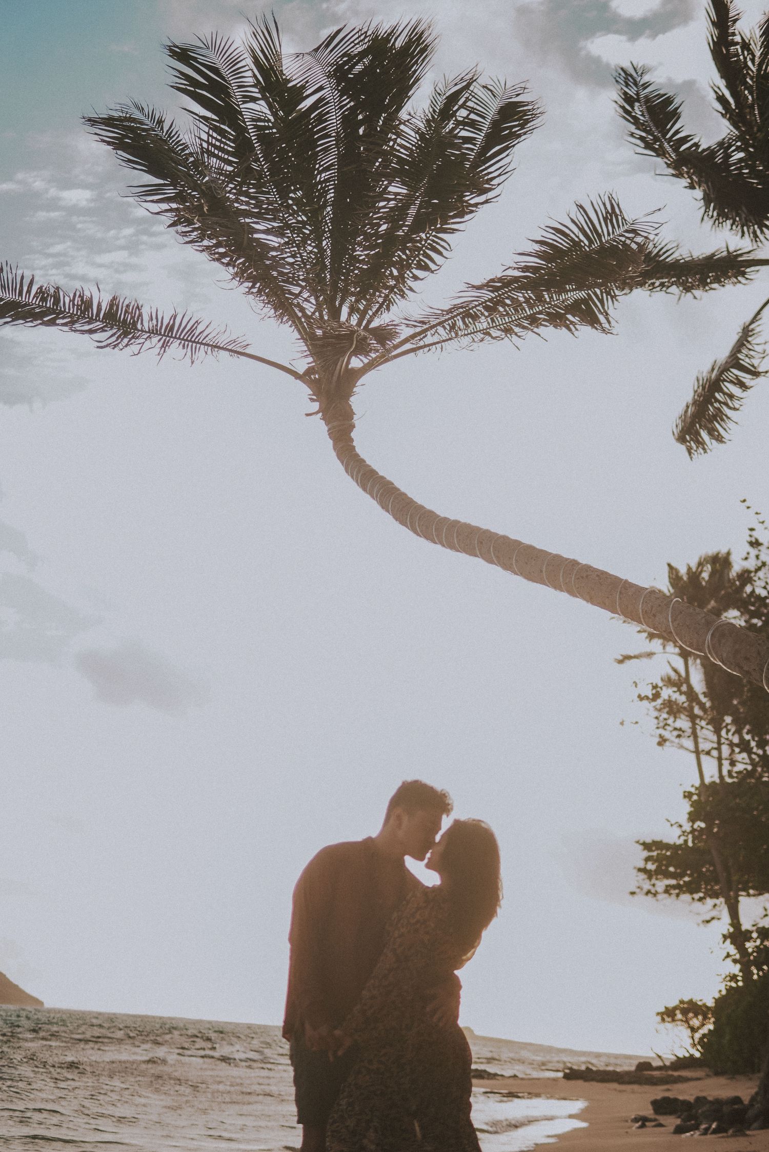 A couple in Hawaii on the beach, couples photoshoot Oahu