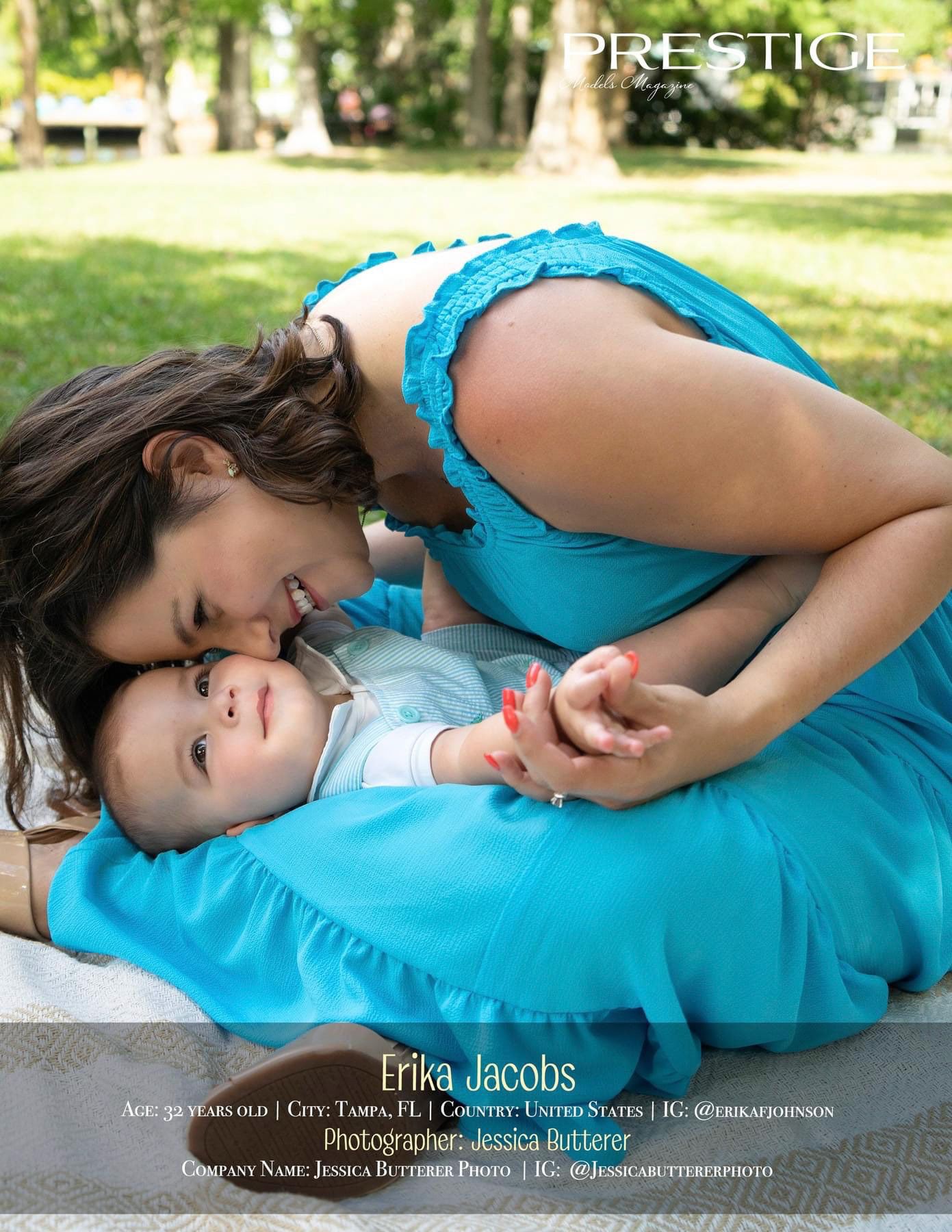 A tender maternal moment captured on a blue blanket during an outdoor photoshoot.