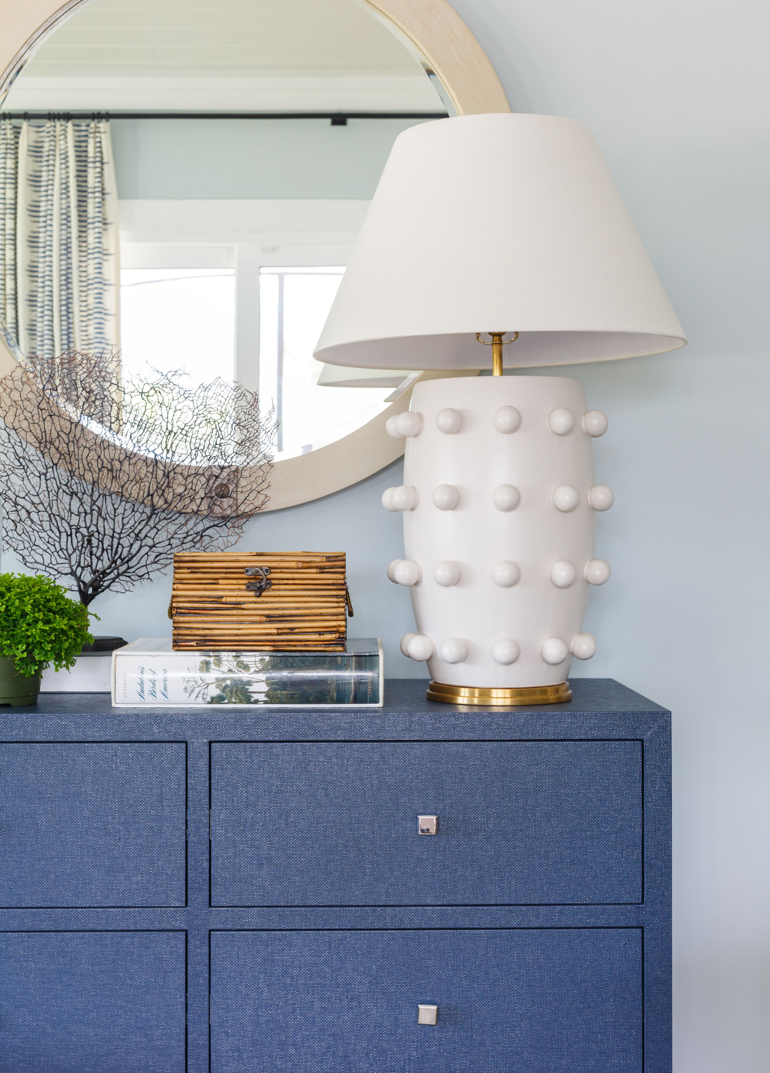 Blue upholstered Lee Industries dresser designed by Orangerie Home.