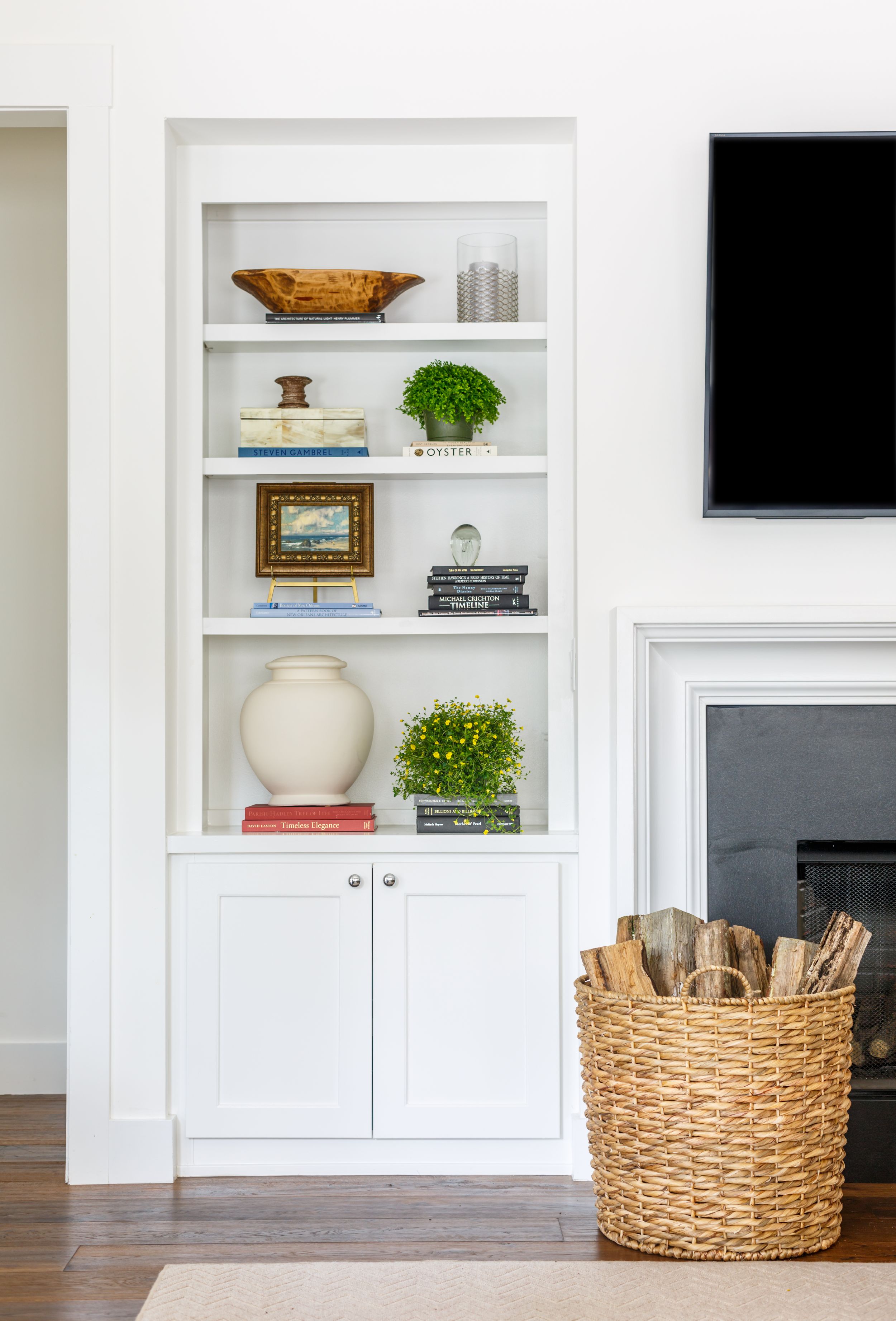 Custom built shelves in coastal family room with antiques.