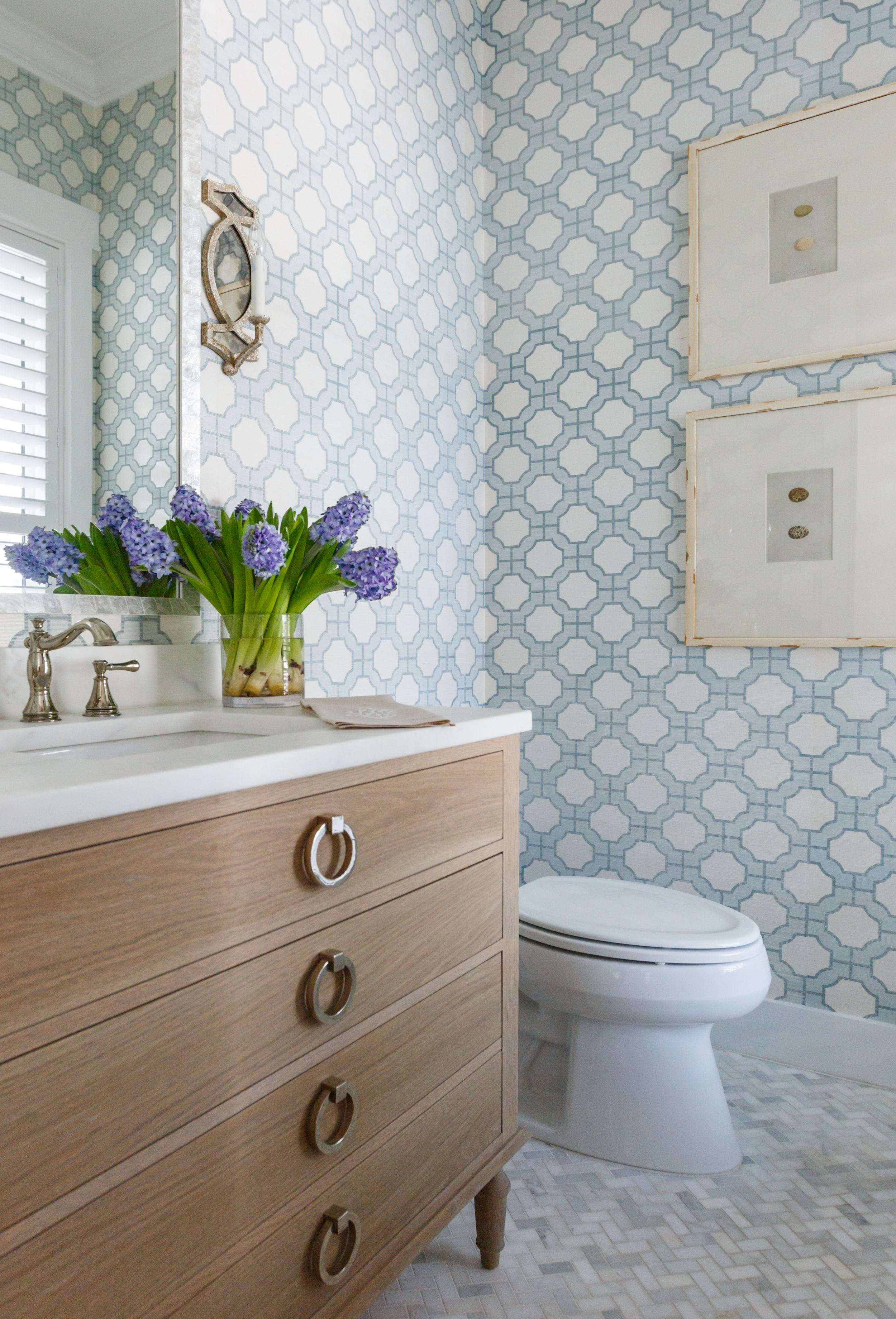 Blue and white Phillip Jeffries wall covering in coastal bathroom.