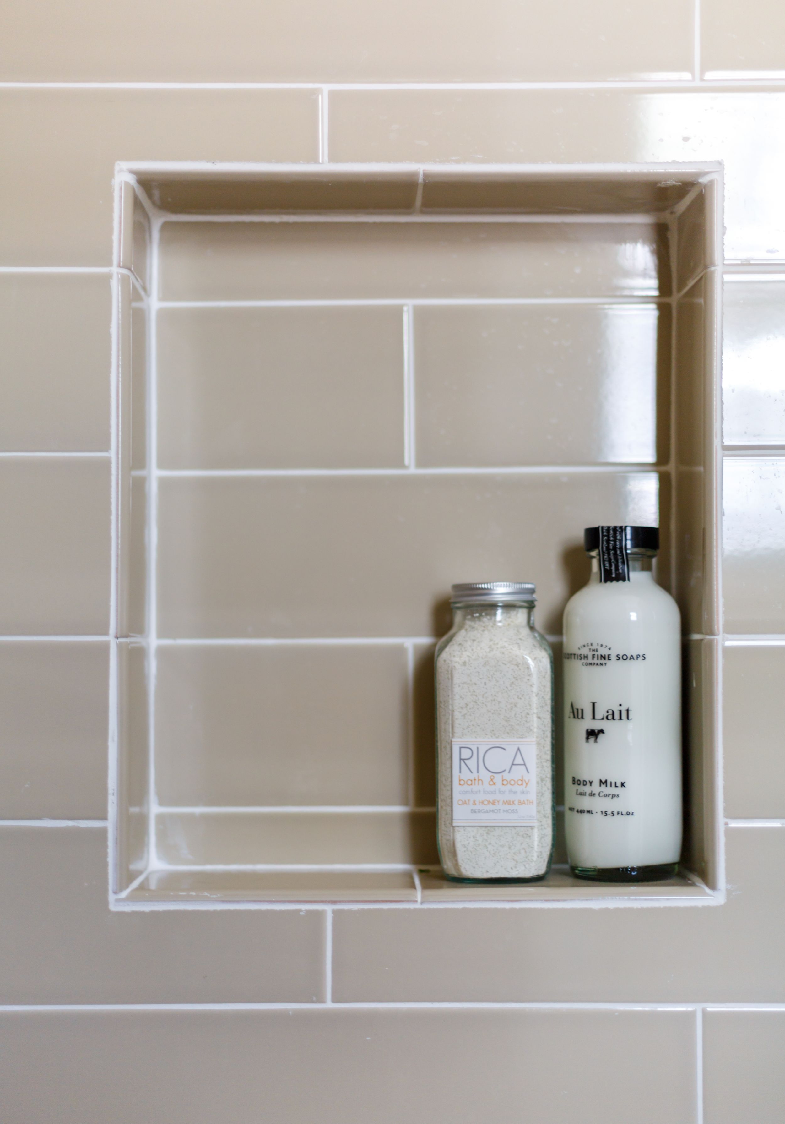 High-end, custom bathroom with beige tiles in shower.