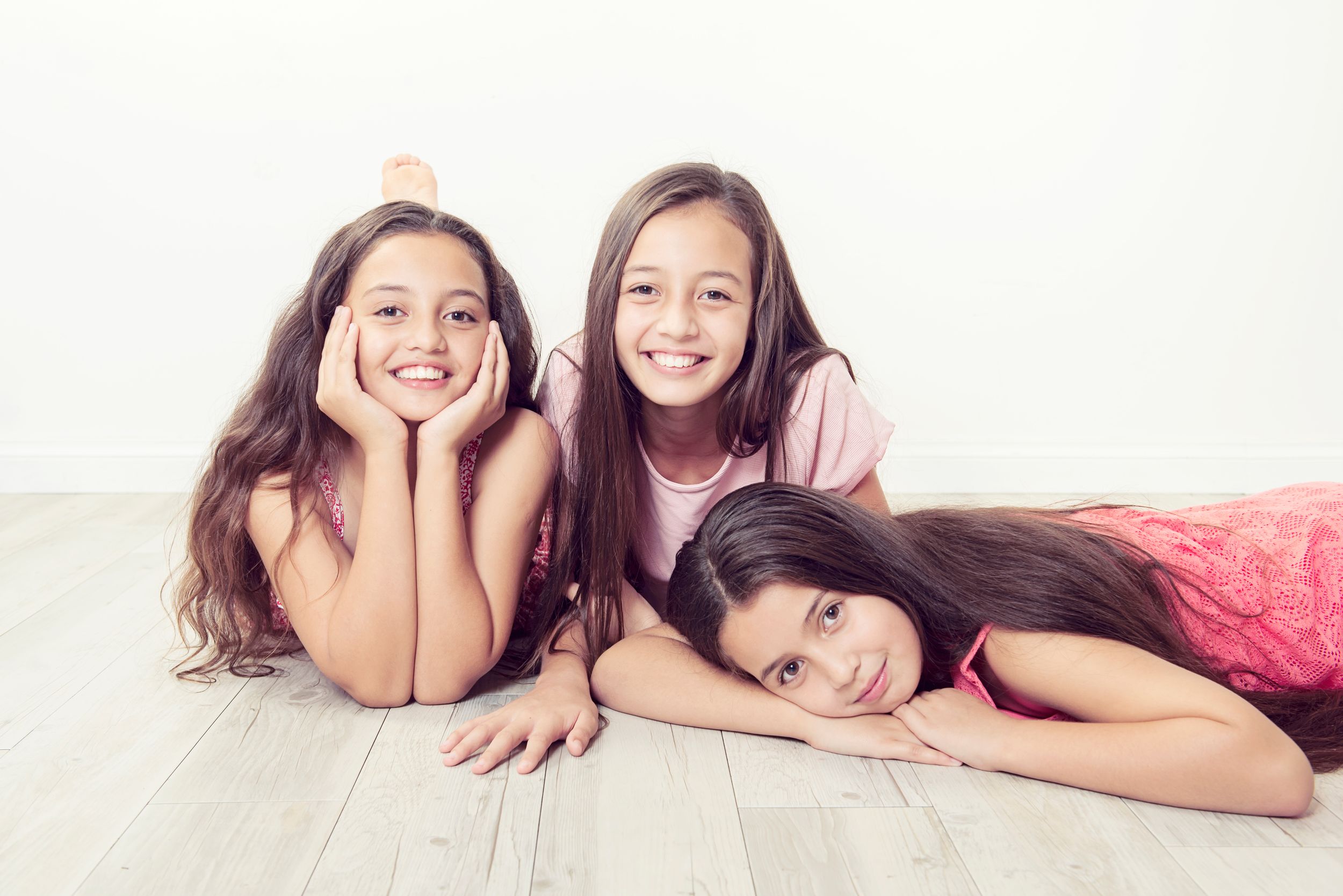 3 sisters relaxing on floor