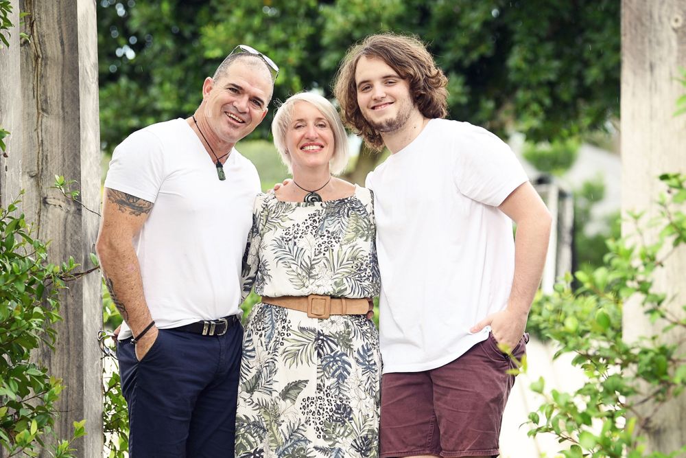 Proud Mum and Dad with son in a garden