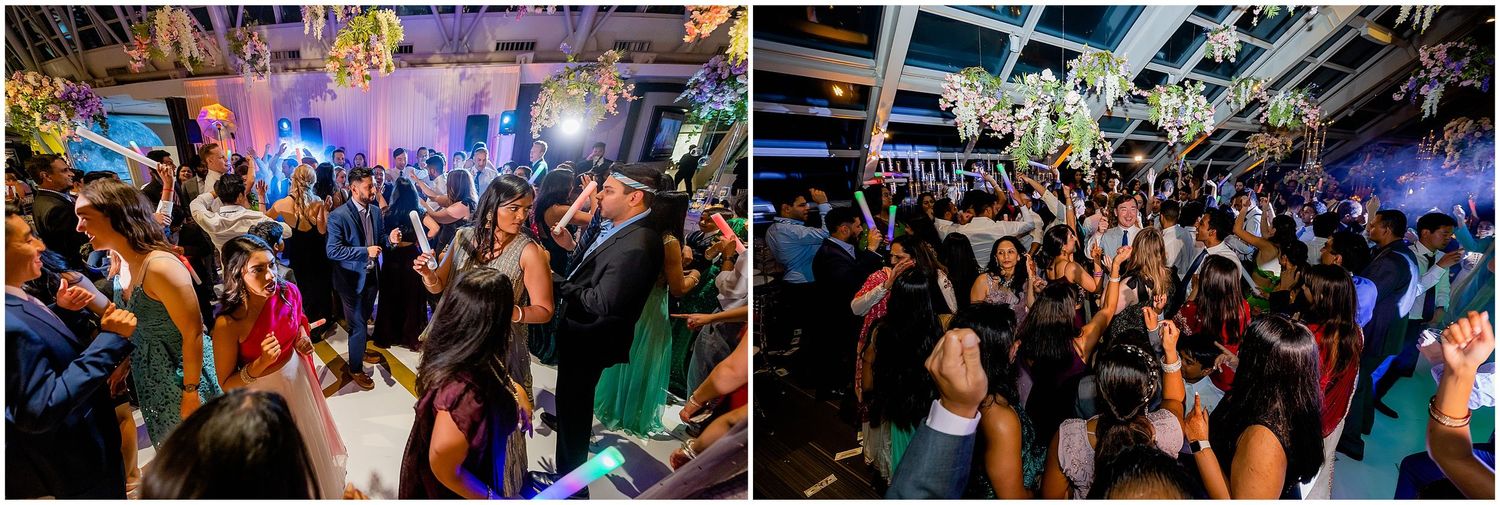 Energetic crowd dancing at a vibrant nightclub reception with blue lighting effects.