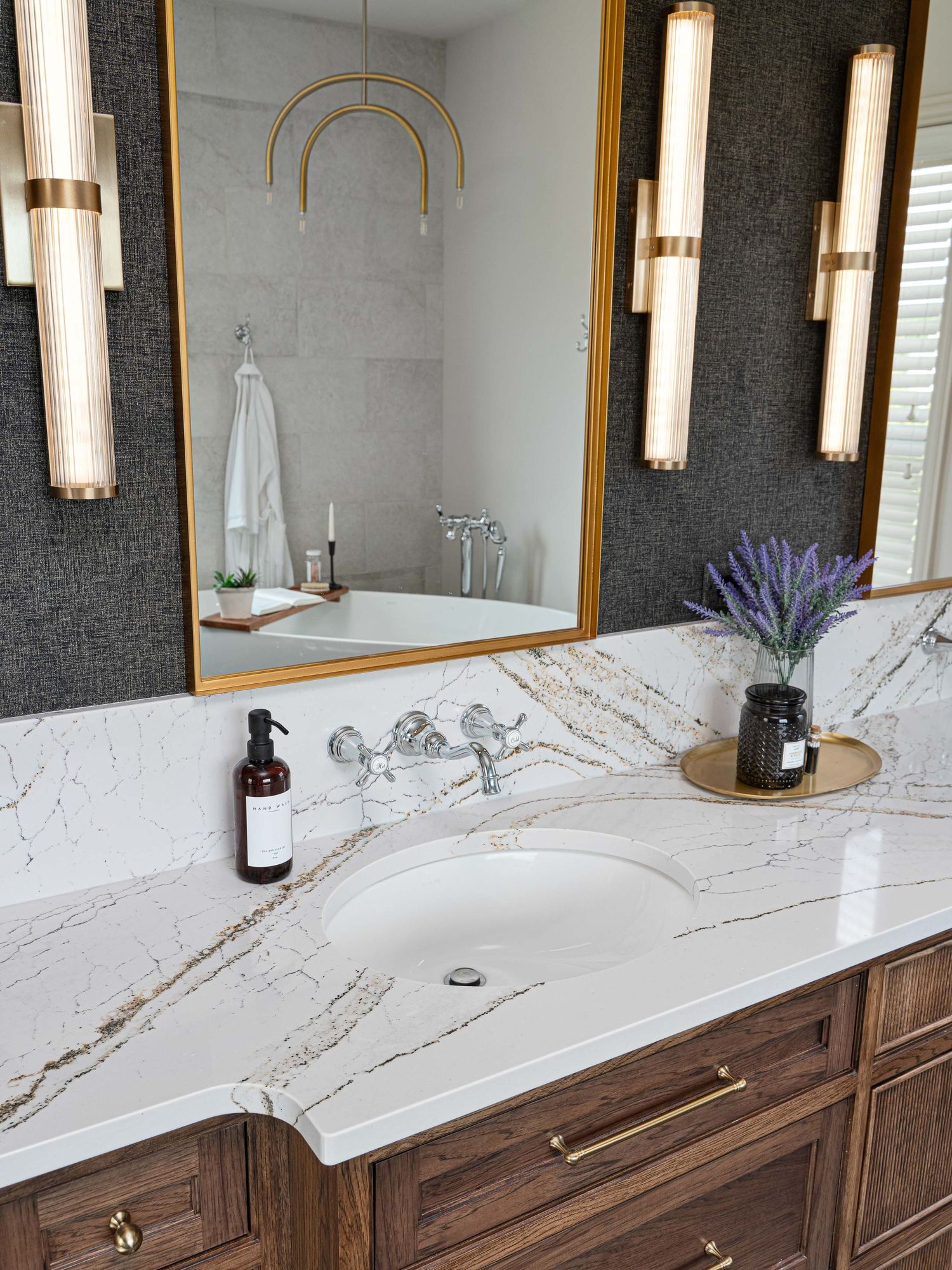 Bathroom vanity with wood cabinets and Cambria counter from a Dublin Ohio interior design and remodel project.