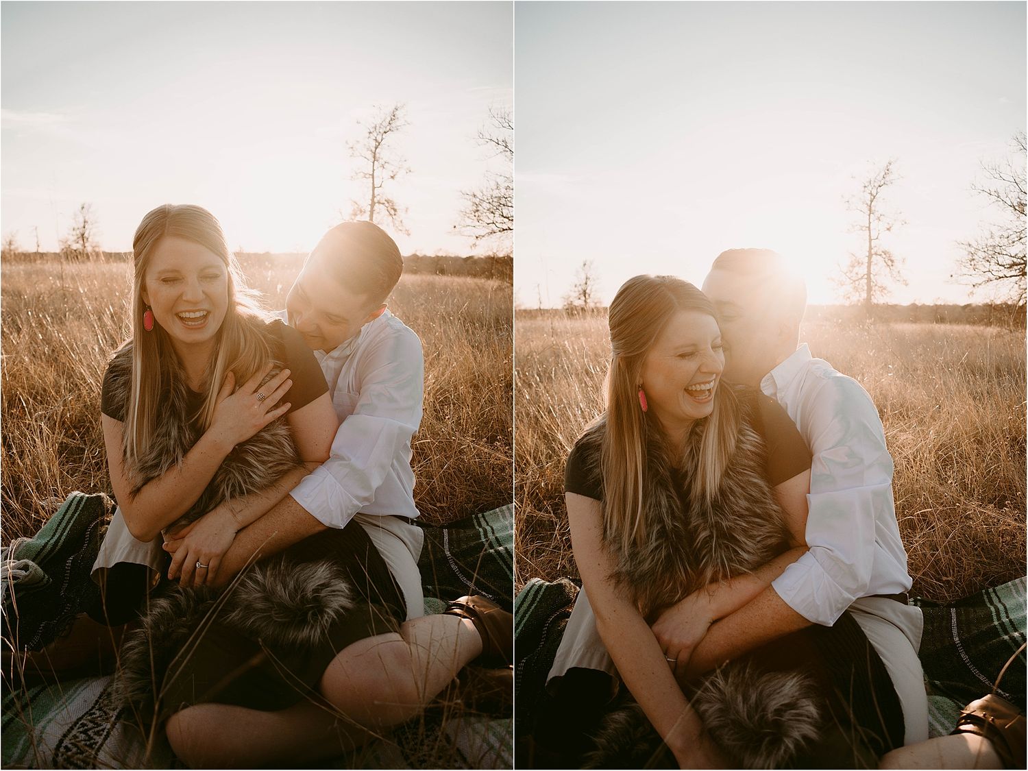 Couple laughs together while sitting in tall grass during sunset.