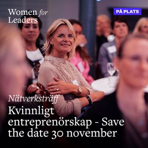 Audience member at a Women for Leaders networking event wearing formal attire.