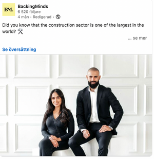Professional photo of two business partners sitting in a bright white office interior.