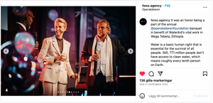 Two performers in white suits on stage with blue lighting effects. Steffo TV4
