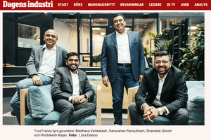 Business team members sitting casually in a modern office setting.