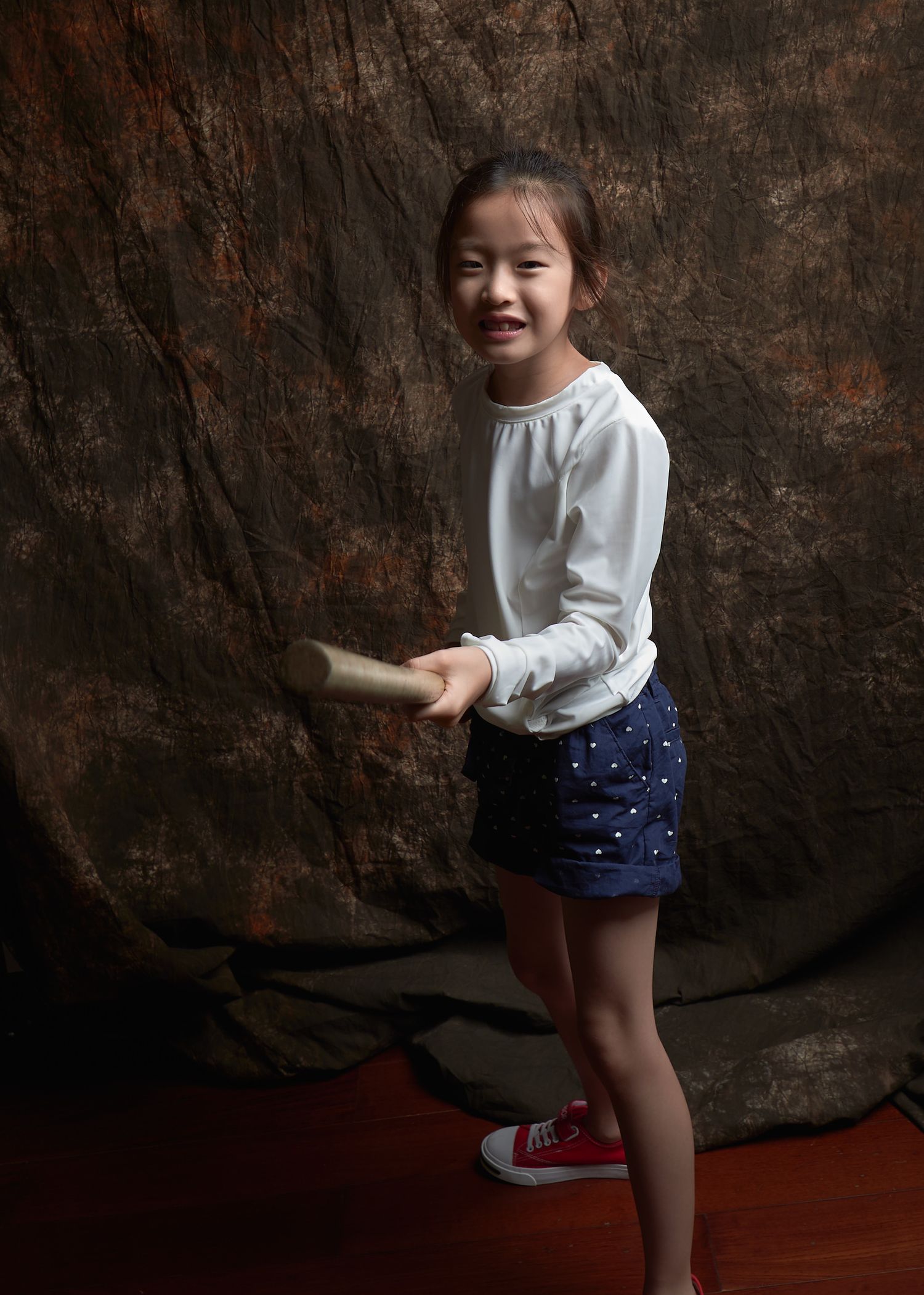 Hester with an Aikido jo Chinese girl birthday photos hyperactive kid fun collaborative game