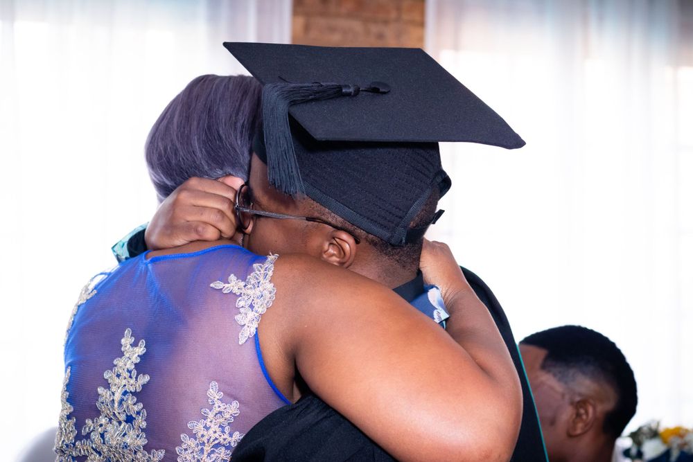 Graduation shoot, with family gathering together to celebrate their sons graduation.