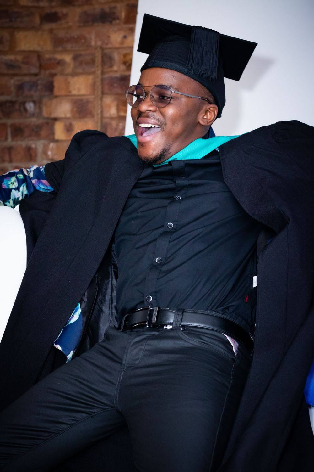 Graduation shoot, with family gathering together to celebrate their sons graduation.
