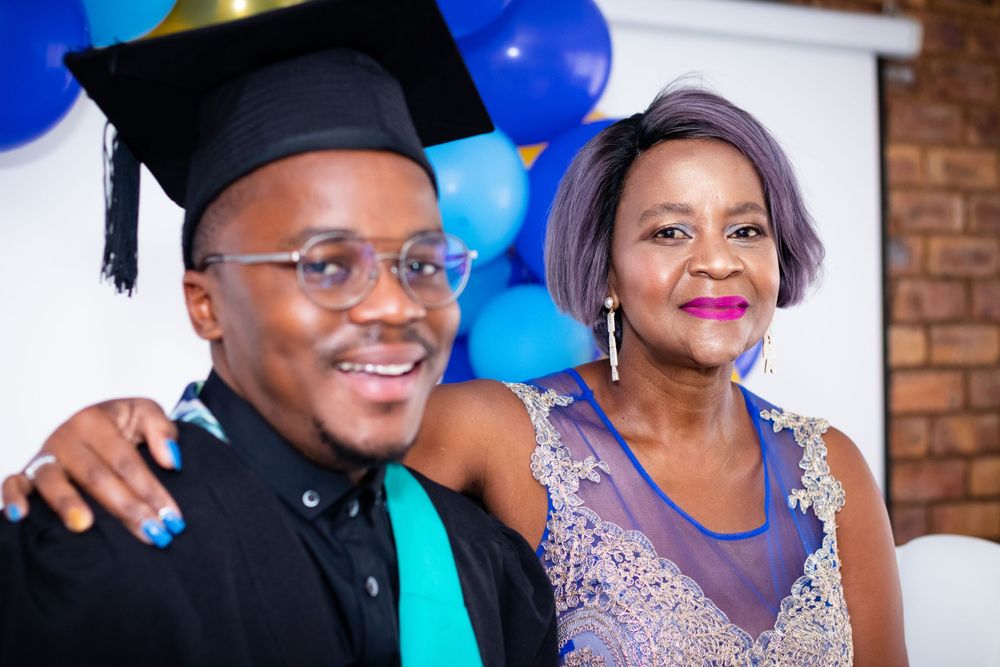 Graduation shoot, with family gathering together to celebrate their sons graduation.
