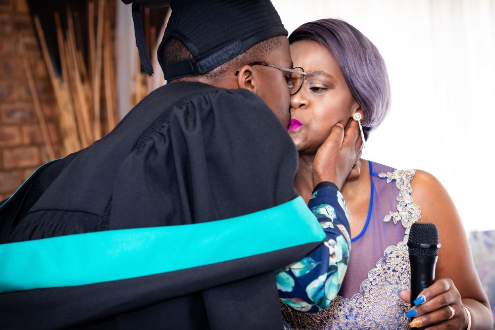 Graduation shoot, with family gathering together to celebrate their sons graduation.